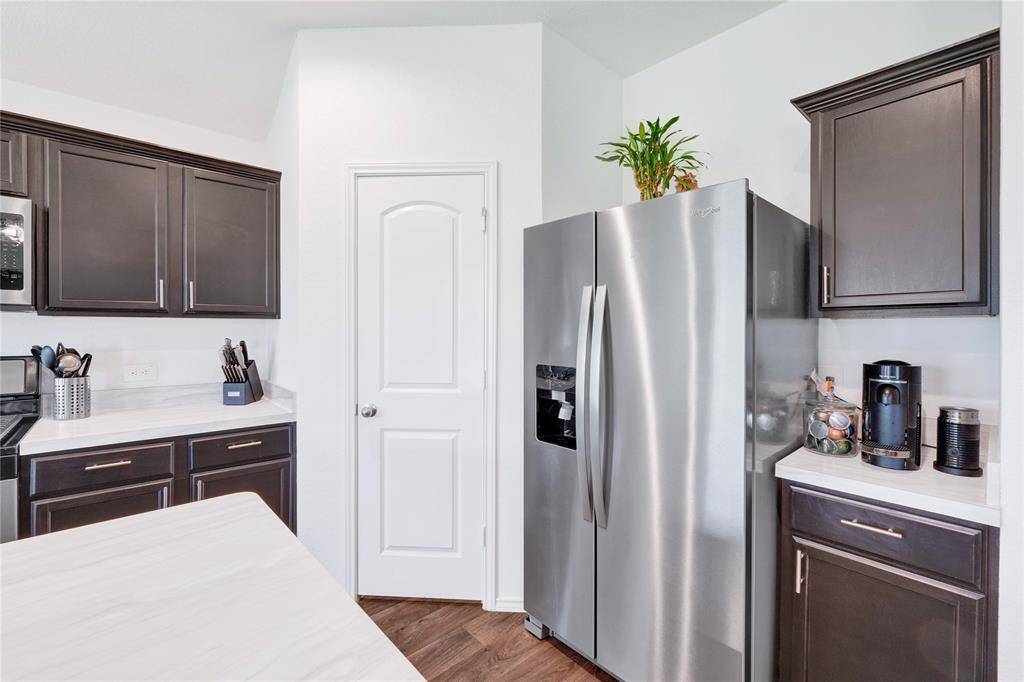 Additional beverage bar area and stainless steel fridge included