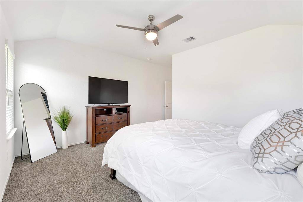 Upgraded ceiling fan in primary bedroom