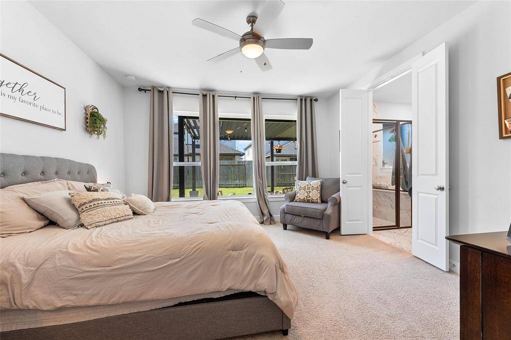 Large Primary bedroom located in the back of the home that leads to the en-suite.