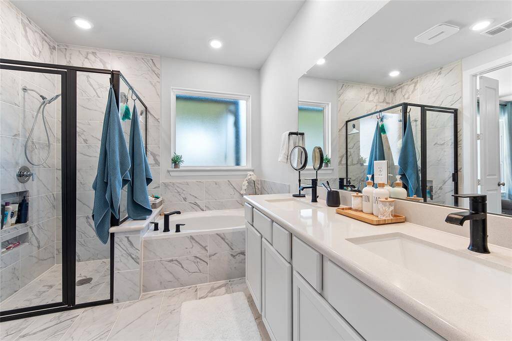 Separate Soaking Tub and Shower in the Primary bathroom. Double sinks and upgraded tile throughout.