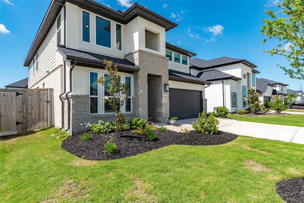 Like new, this home contains gutters all the way around, a sprinkler system, and is constructed of Hardie, Brick, Stone, and Stucco.