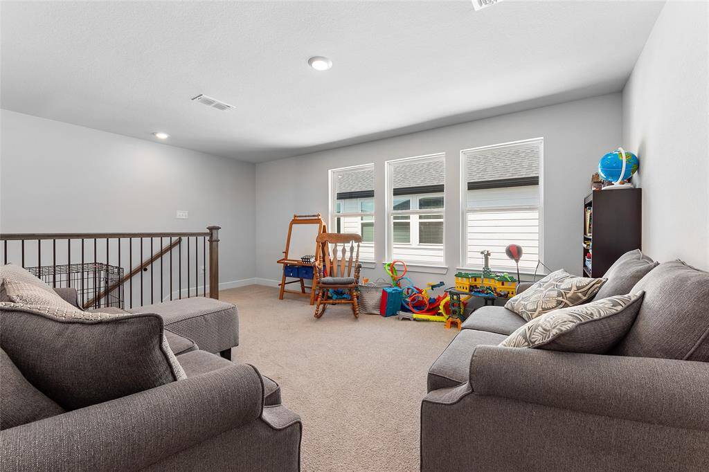 Upstairs Gameroom. (Again, this floor plan had the option to upgrade and open that area to the left of the top of the stairs. You can create an additional 300-400sqft making it the perfect media room).