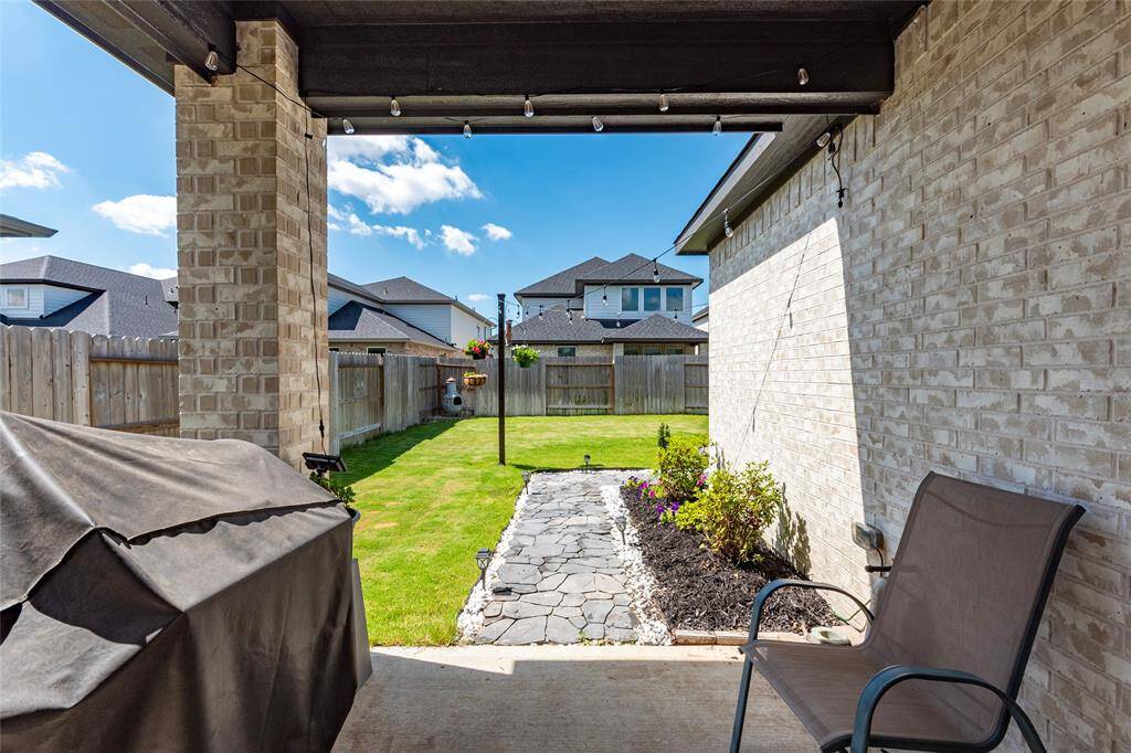 Pathway was added just a year ago, leading to the pergola and additional covered back patio.