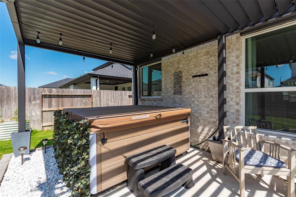 Hot Springs Hot Tub with Seat Cover. (Stays with the property). Pergola also opens and closes so you can stay completely dry when it rains.