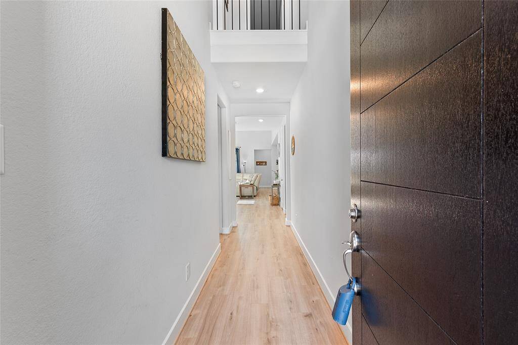 Upon entering the home, you are greeted with high ceilings, luxury vinyl plank flooring and 5" baseboards throughout.