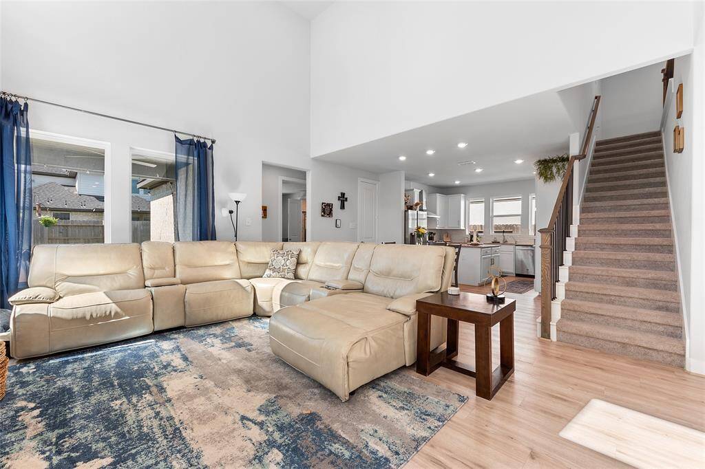 A beautiful view of the family room located right off of the kitchen and breakfast area. (The area above the kitchen, to the left of the top of the stairs, is all attic space that can be turned into livable space. Access to that area can be found in the crawl space of the master closet).