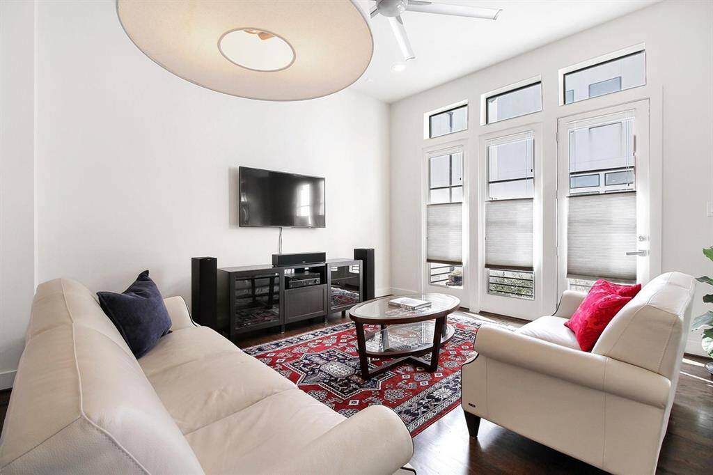Reverse angle of the living area - notice the clar-story windows and the door that leads out to...