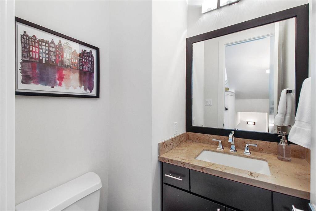 Strategically located, the guest bath at top of stairs on the Second floor. Beautiful Sandstone countertops as well!
