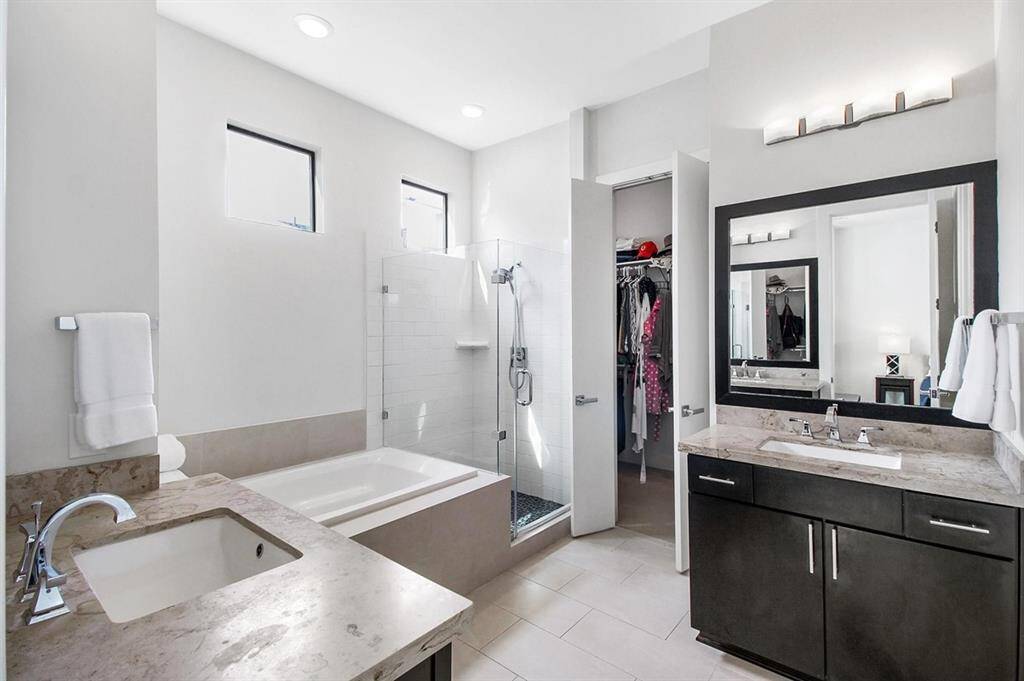 Relax after a long day in the primary spa-inspired bathroom. Luxury at it's finest.