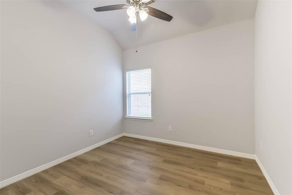 Secondary Bedroom – Comfortable space with natural light and LVP flooring.