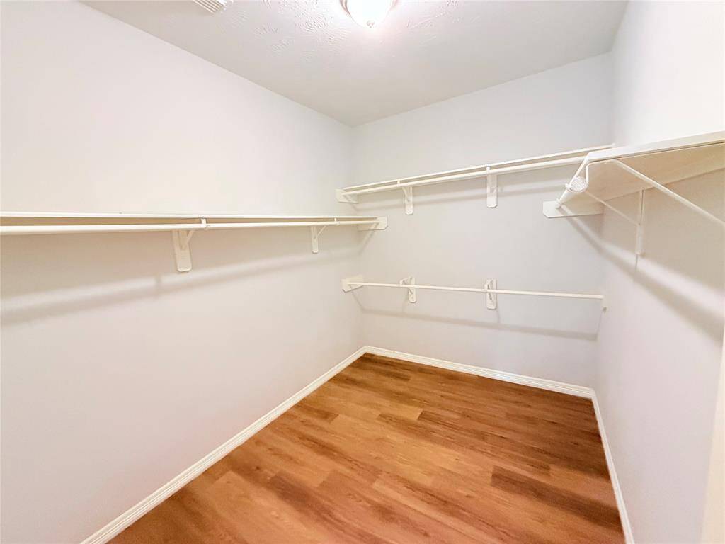 Secondary Bedroom – Comfortable space with natural light and LVP flooring.