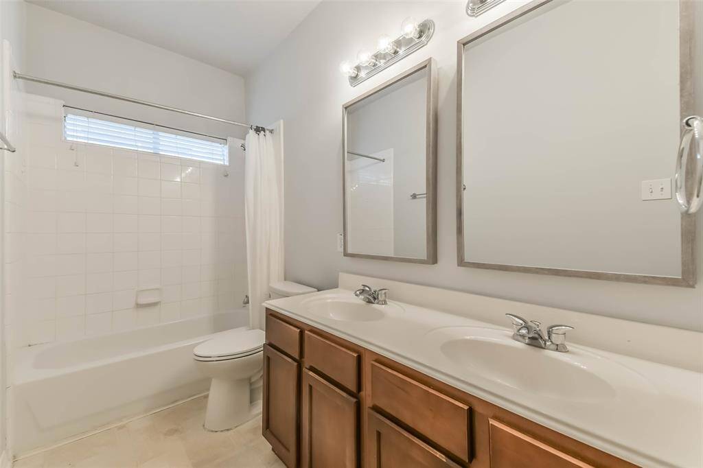 Secondary Bathroom – Clean and bright with updated flooring and fixtures.