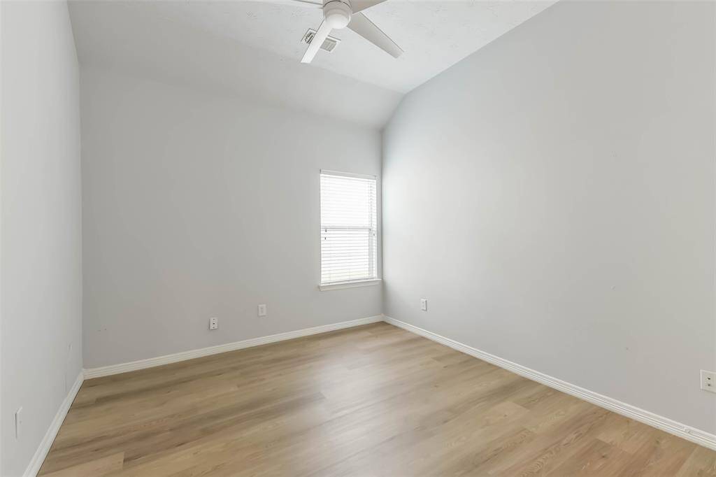 Secondary Bedroom – Comfortable space with natural light and LVP flooring.