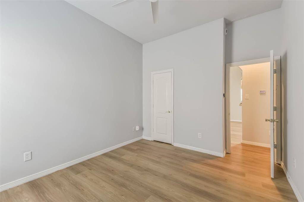Secondary Bedroom – Comfortable space with natural light and LVP flooring.