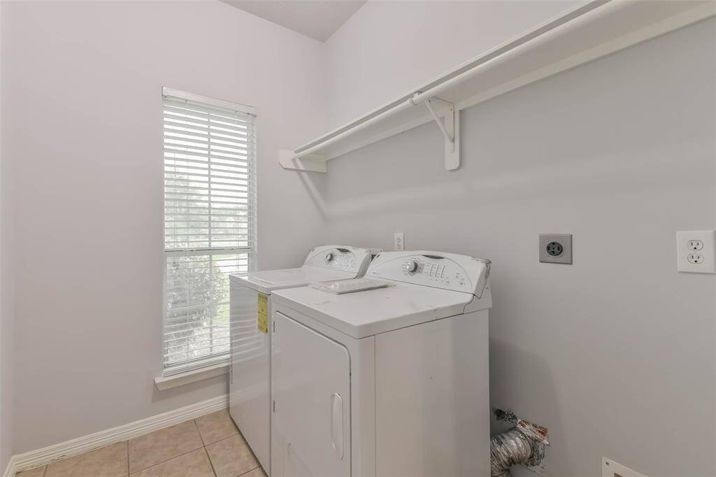 Utility room indoors with washer and dryer