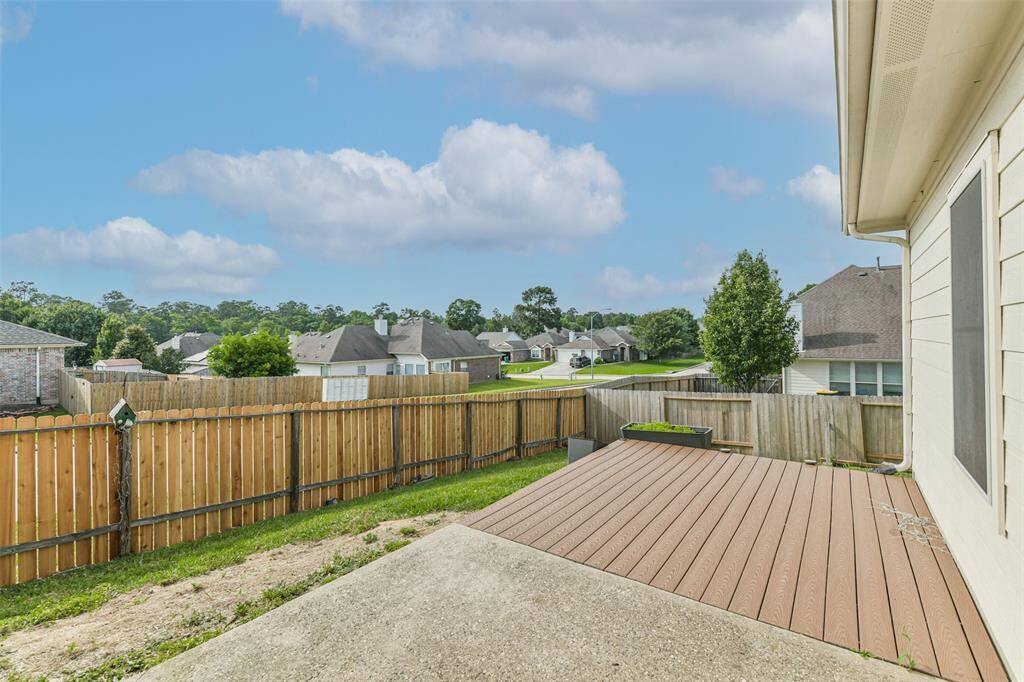 Fully fenced yard with patio—great for relaxing or entertaining.