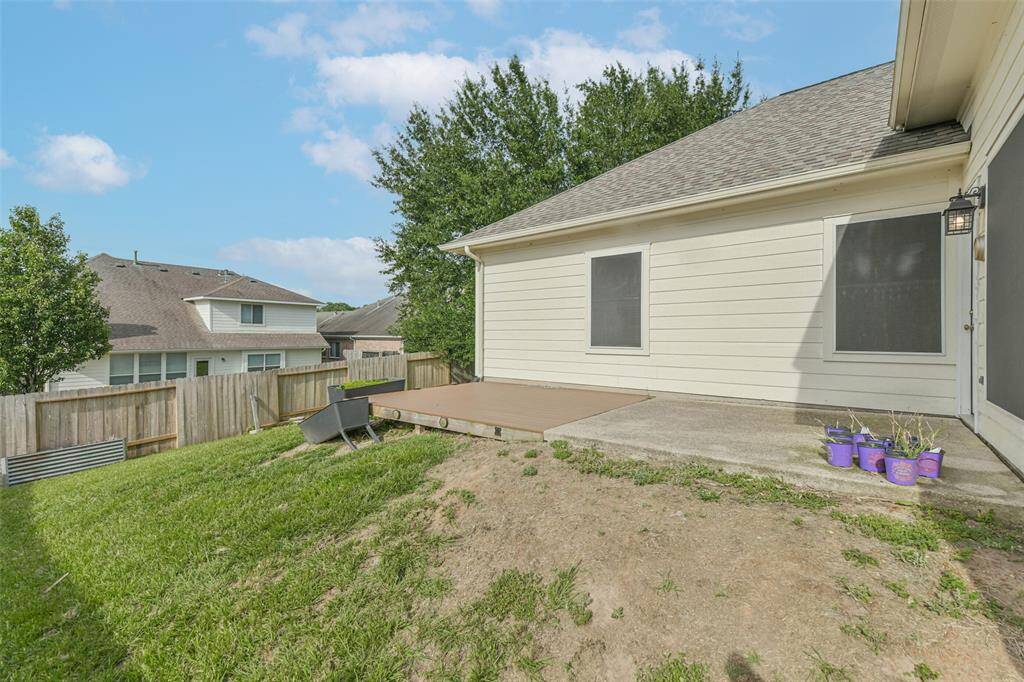 Fully fenced yard with patio—great for relaxing or entertaining.