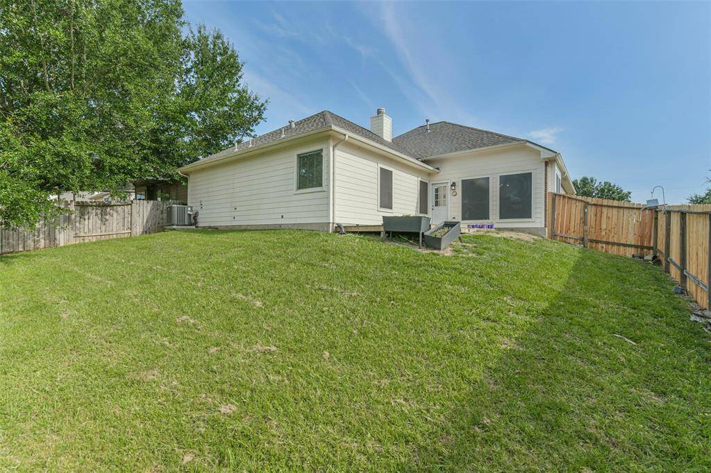 Fully fenced yard with patio—great for relaxing or entertaining.