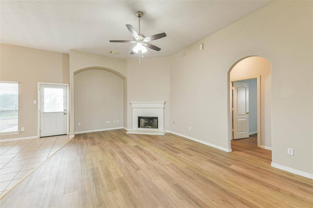Bright space with high ceilings and cozy gaslog fireplace.