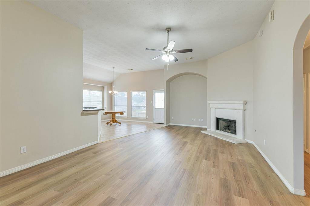 Bright space with high ceilings and cozy gaslog fireplace.