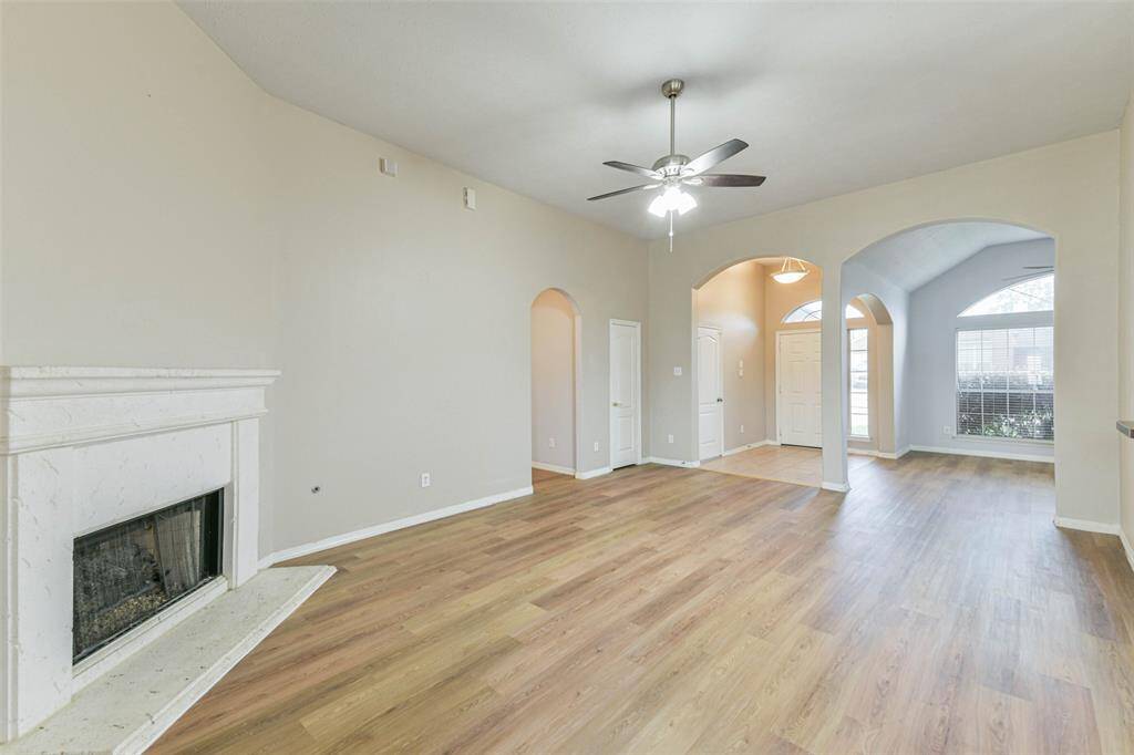 Bright space with high ceilings and cozy gaslog fireplace.