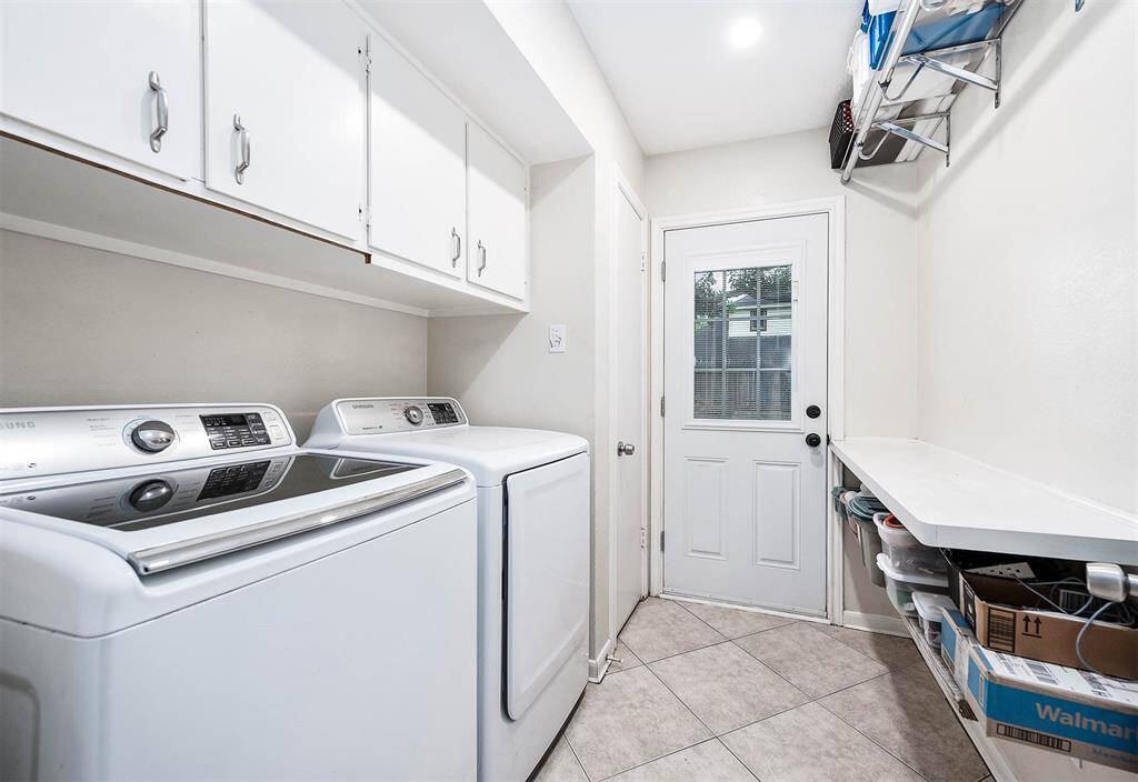 In house laundry/utility room with storage space.