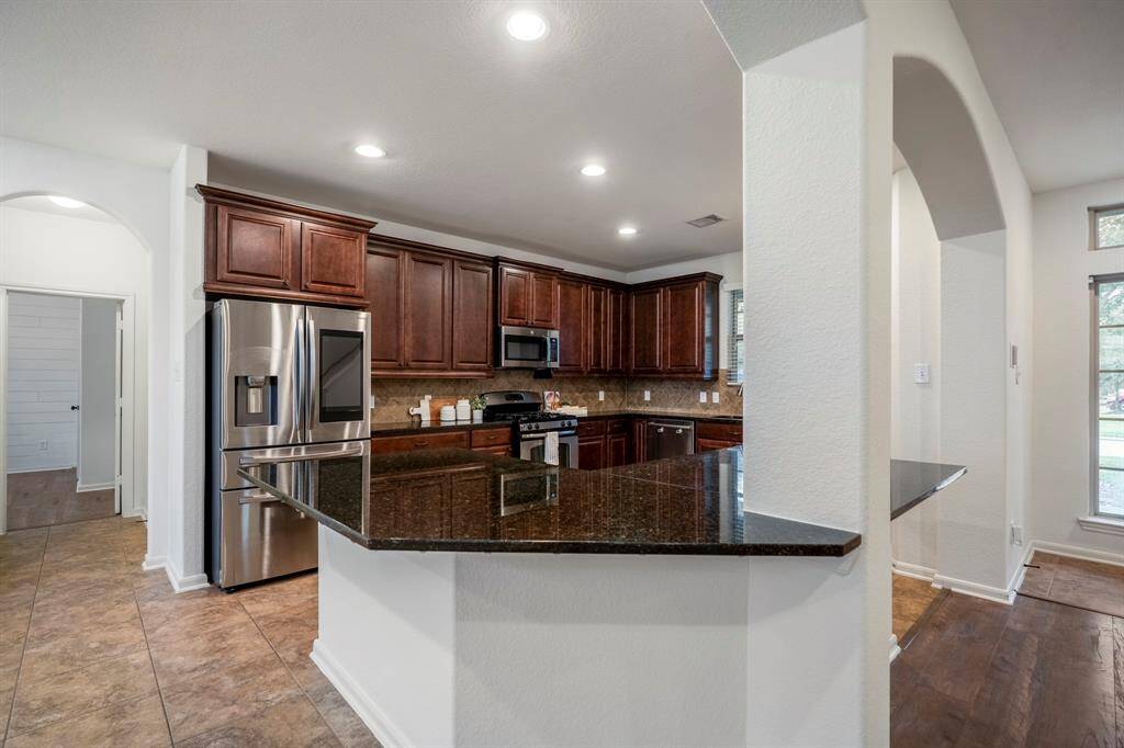 Ideal for entertaining, this kitchen offers ample space for seating and conversation while cooking.