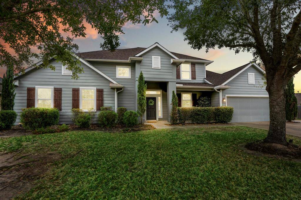 Charming exterior with inviting landscaping and a welcoming entrance.