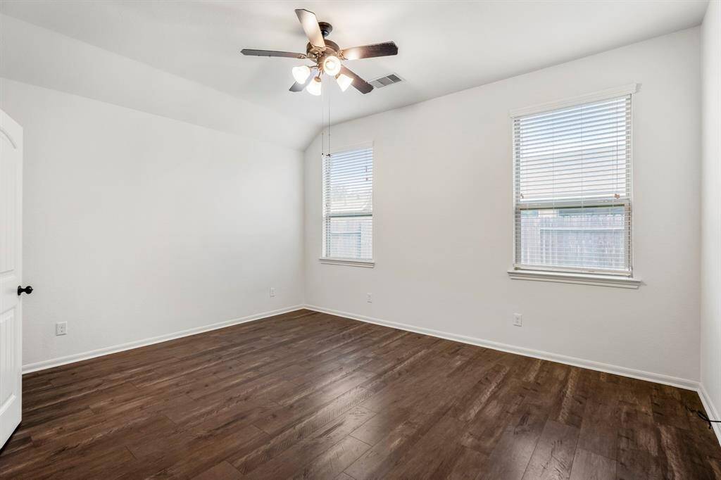 Spacious primary bedroom conveniently located on the main floor.