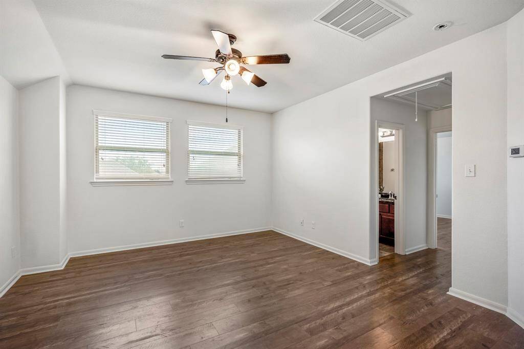 Spacious upstairs game room, perfect for entertainment and relaxation.