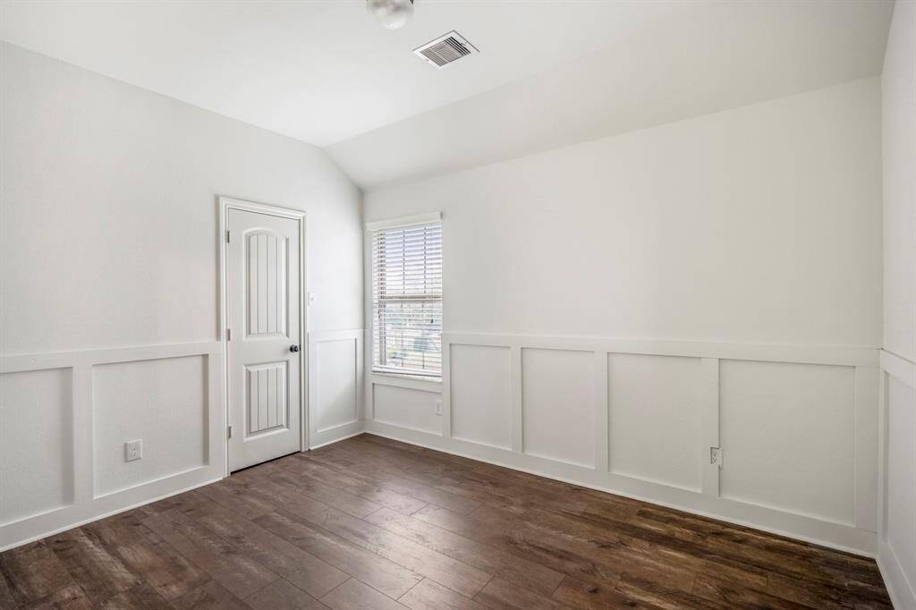 Bright upstairs bedroom with abundant natural light.