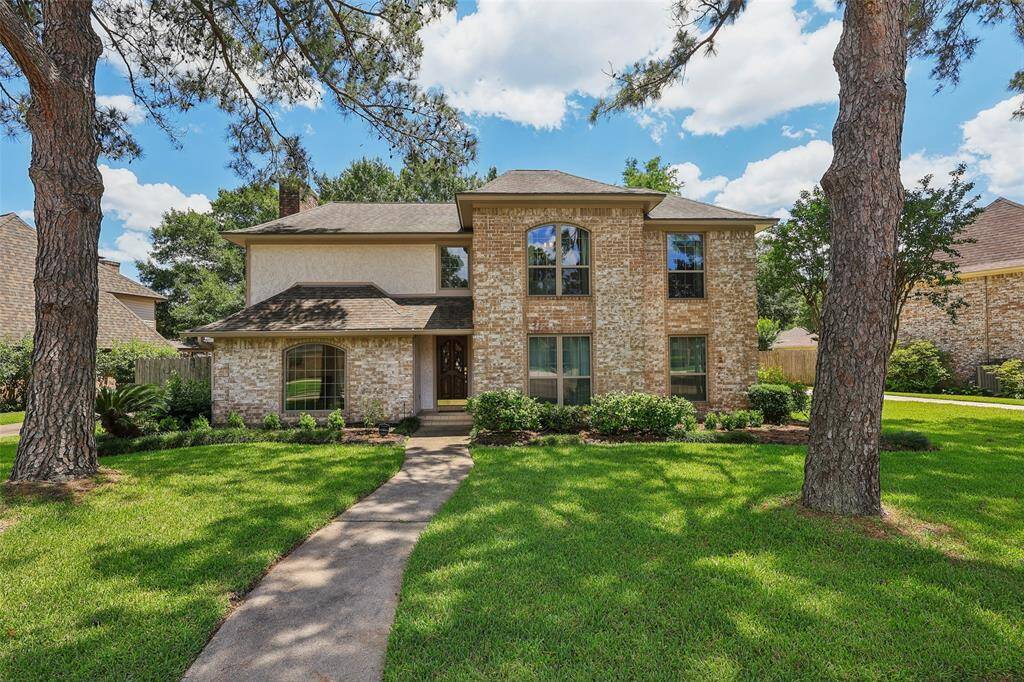 Charming home in an established neighborhood with mature trees offering shade, privacy, and timeless curb appeal