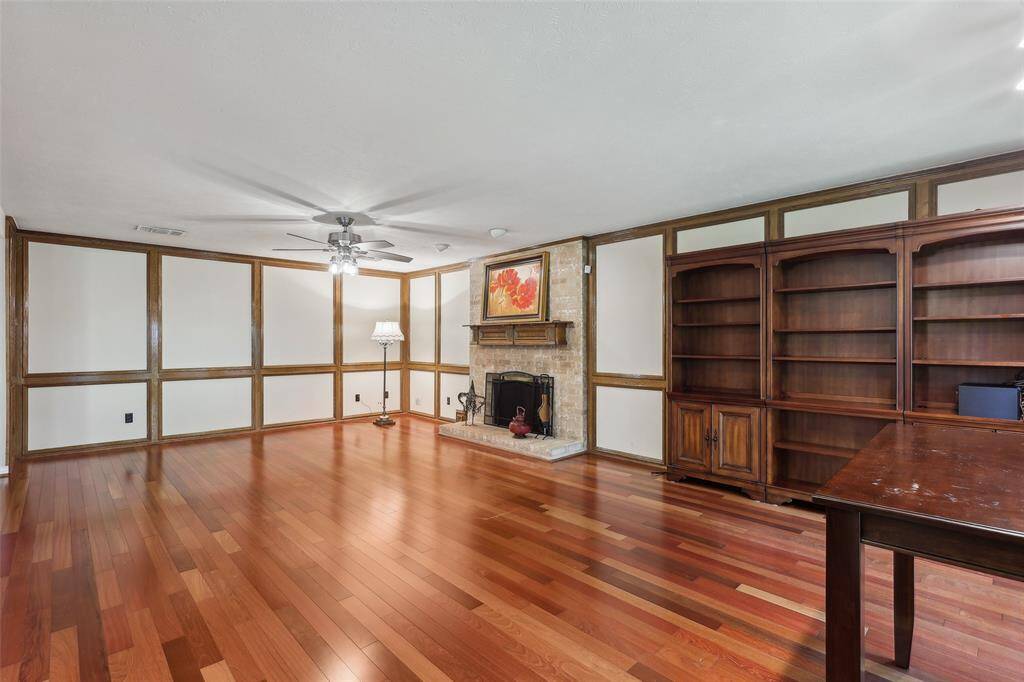 Family room offering cozy gas log fireplace, perfect for relaxing or entertaining