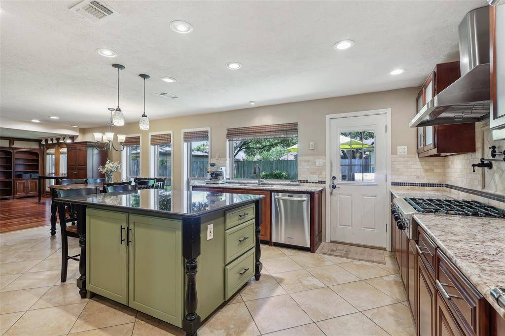 Kitchen features a custom island with plenty of storage space, perfect for meal prep and organization.
