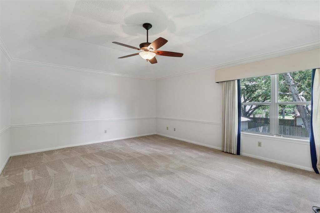 Spacious and open primary bedroom offering ample room for furniture and a relaxed, comfortable atmosphere, perfect for unwinding after a long day