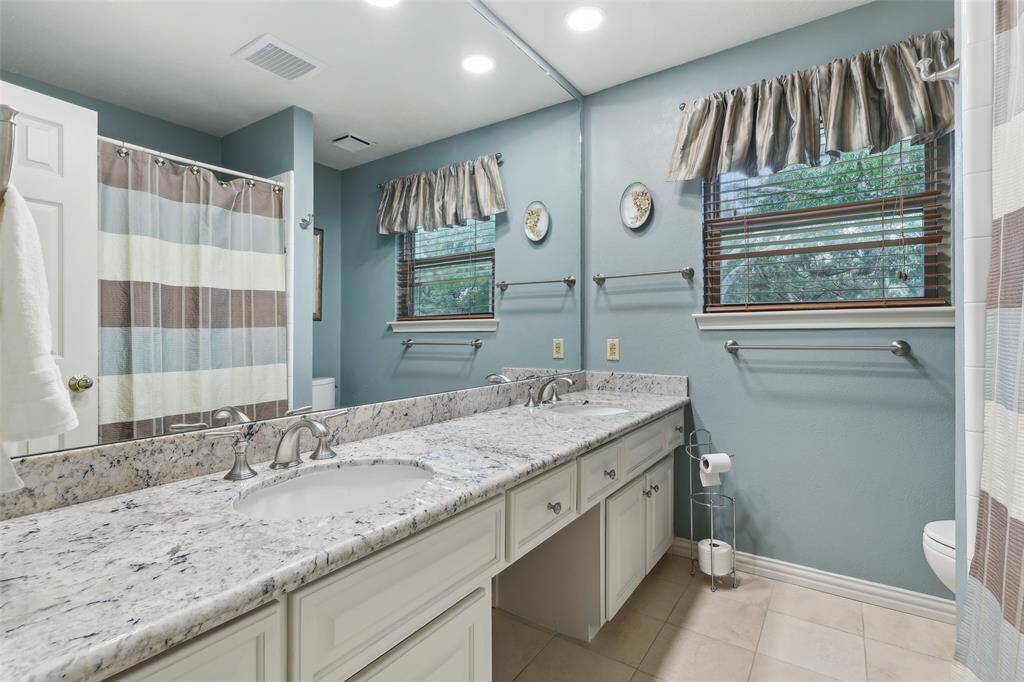 2nd full bath up offering double sinks and granite