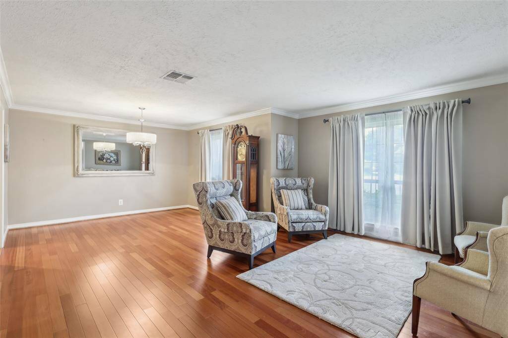 The home boasts a large, open formal living and dining area—perfect for entertaining or gathering with family