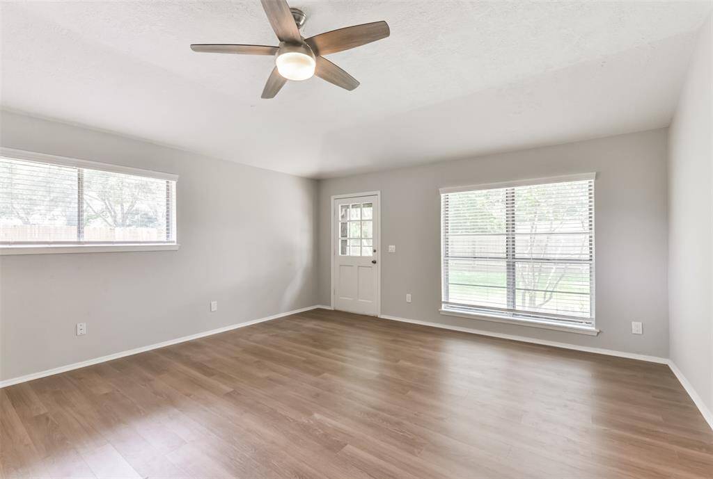 Alternate view of FLEX ROOM showcasing EXTERIOR DOOR and OVERSIZED WINDOWS.