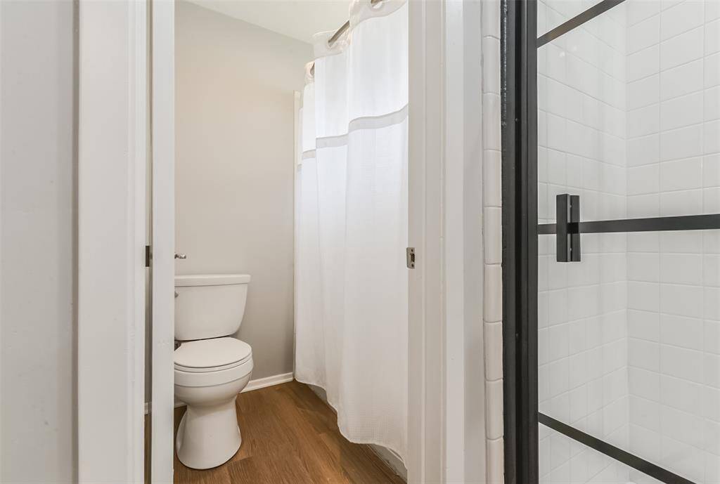 View of primary bathroom bathtub adjacent to the shower.