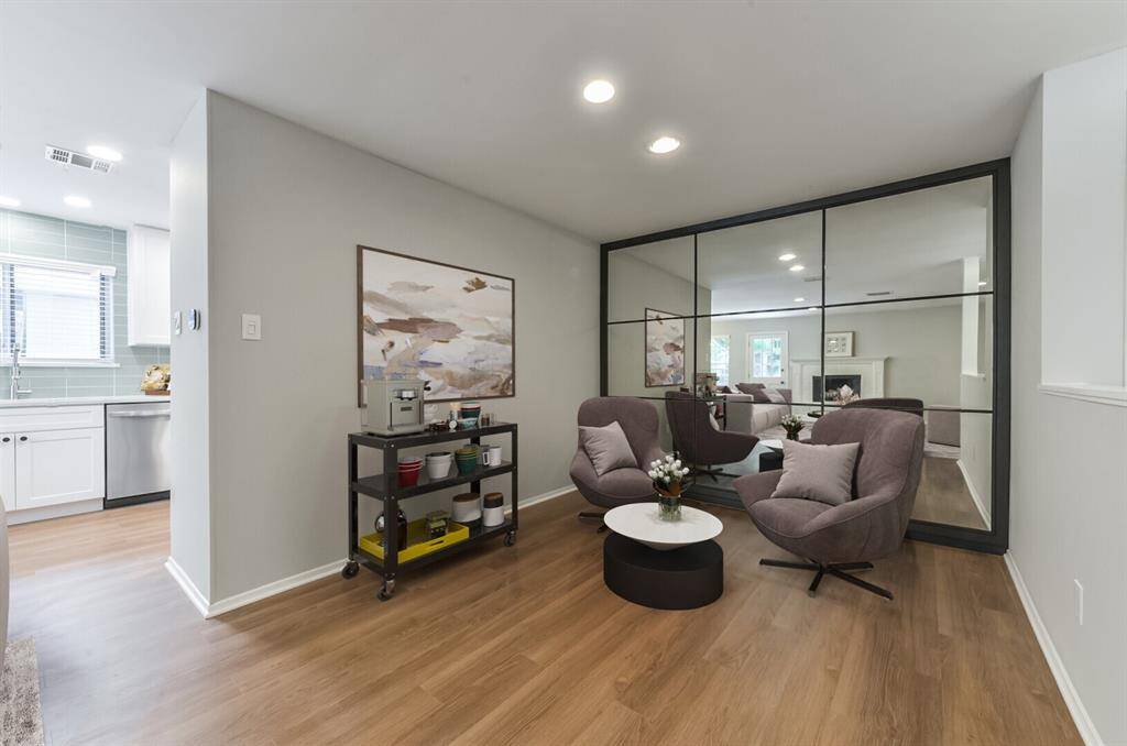 Beautifully updated and modern space virtually staged as seating area. Would make a great dining room too!