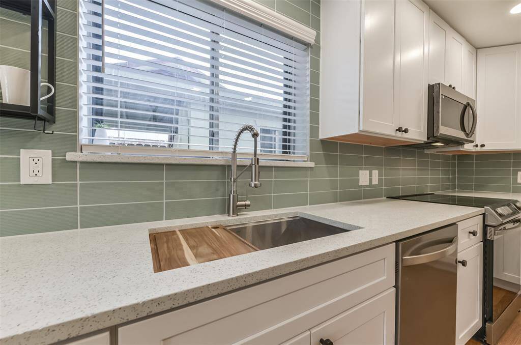 You will be spoiled by this oversized sink with removal cutting board accessory and large sprayer kitchen faucet.
