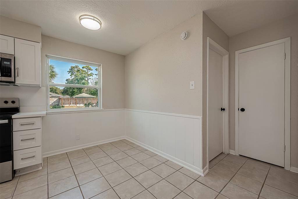 Breakfast area with a street view, utility room located adjacent.