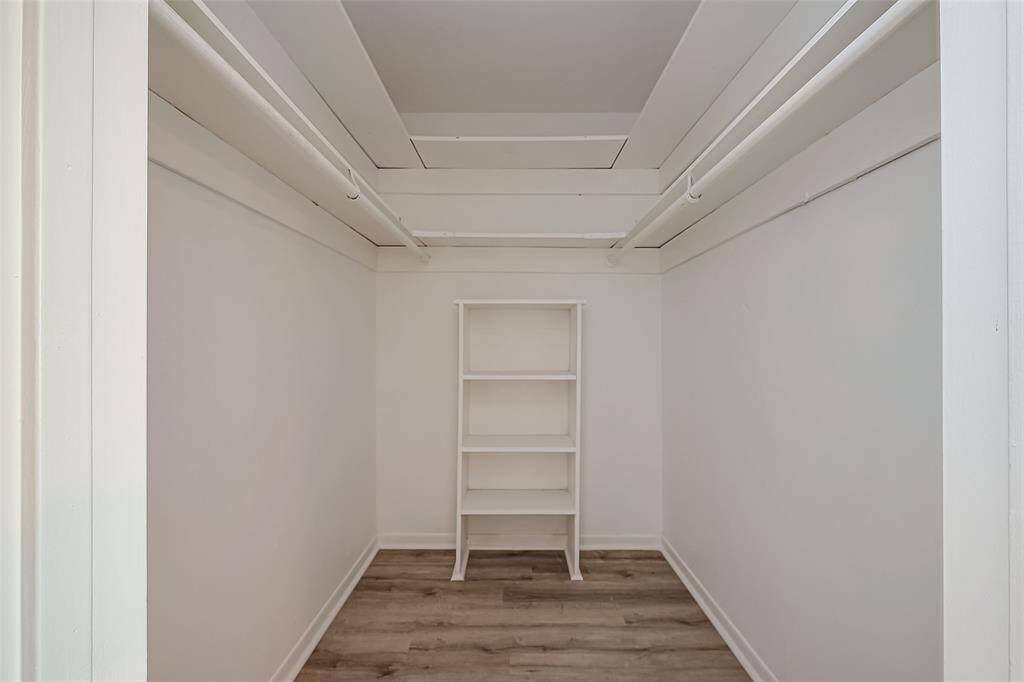 View of the primary walk in closet.