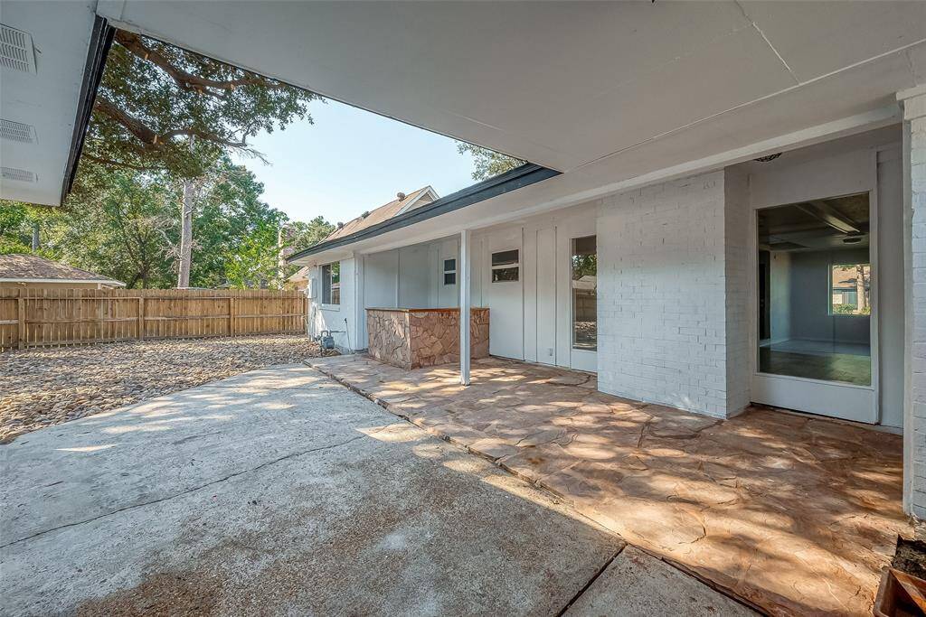Patio area equipped with an outdoor bar, perfect for social gatherings.