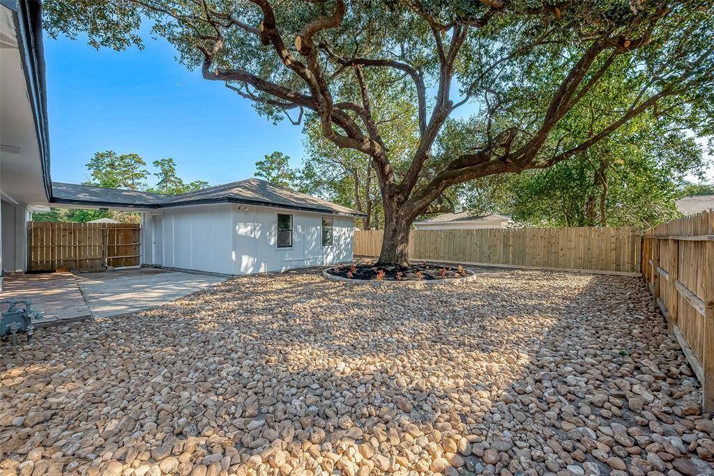 Newly installed fence for the open backyard.
