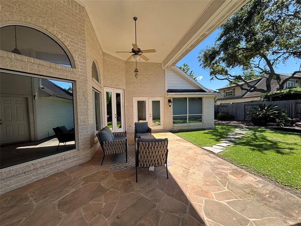Spacious kitchen featuring a central island and high-end grill stove, perfect for culinary enthusiasts.