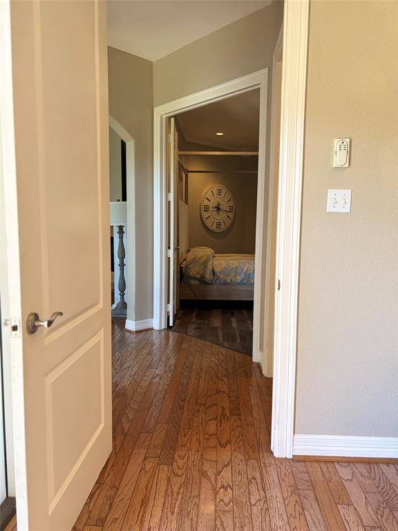 Explore this inviting guest suite, perfect for multigenerational living. It features a chic kitchenette with granite countertops and custom cabinetry, plus a cozy living area with bar seating. The private bedroom and full bathroom ensure comfort and privacy, making it ideal for in-law quarters or extended stays.
