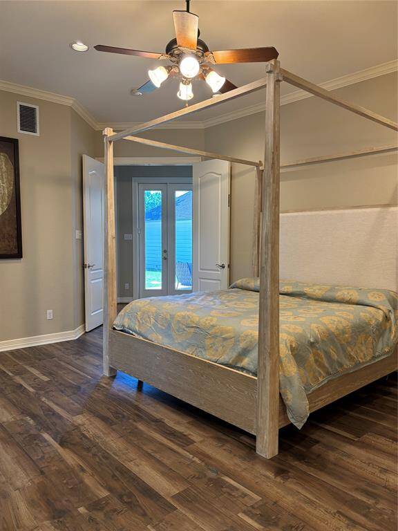 This inviting guest suite offers comfort and privacy, perfect for visitors. The open living area includes a cozy sitting space, built-in sink, full-size fridge, and ample cabinetry. A private bedroom and full bath provide a quiet retreat, enhanced by recessed lighting, a ceiling fan, and bar seating.