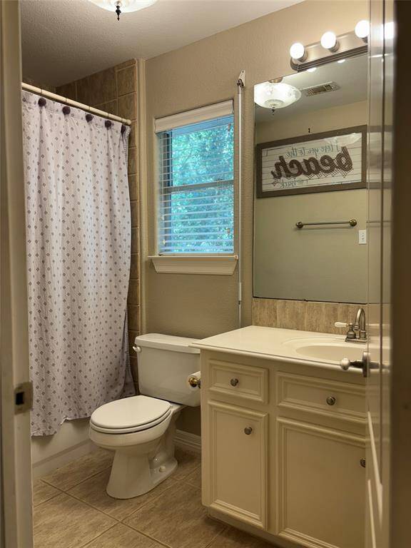 Upstairs hall Step into the upstairs level featuring a spacious hallway with vaulted ceilings, soft neutral tones, and plush carpet throughout—creating a warm and inviting ambiance. This level includes two well-appointed bedrooms, each offering comfort and charm.