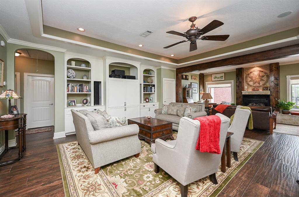 New arches for design consistency, sutom cushions for window sitting, and fireplace area. Custom window treatments.